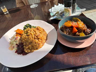 Seven Colours Eatery: yellow sauced grains with slaw and a braised stew bowl