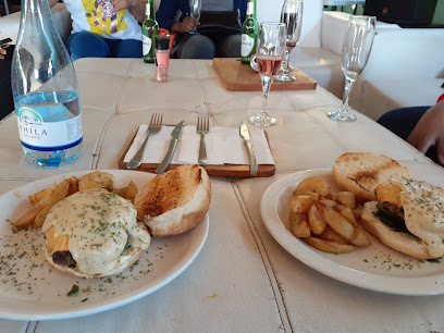 Orgasmic Gawulo plated burgers with melted cheese and potato wedges
