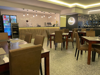 Otto's Cafe interior with dining tables and service counter