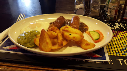 Pub plate at The Royal Oak Pub: sausages, potato wedges, mushy peas