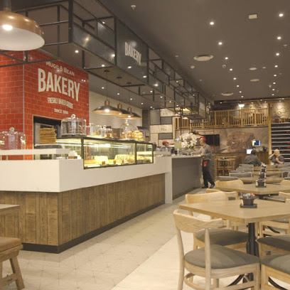 Mugg & Bean Chelsea Village café interior with bakery counter and seating