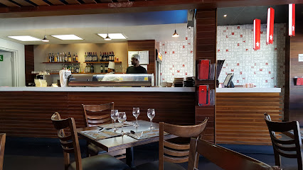 Simply Asia Plattekloof dining area with set tables and bar