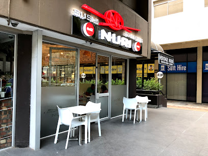 Nuri Sushi Express Cavendish storefront with two outdoor tables