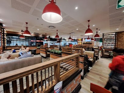 Panarottis Somerset West dining room with booths, sofas and red pendant lights