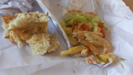 Da Gama Fish City takeaway fried fish with chips and salad in paper