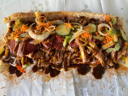 Sam's Fisheries gatsby loaded with chips, polony, shredded salad and sauces