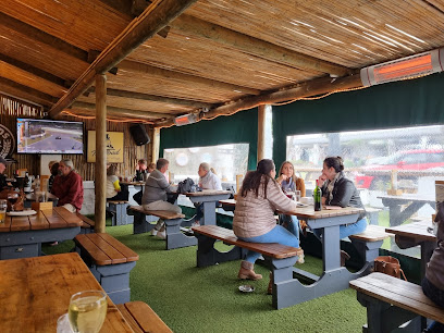 Patrons dining in covered beer garden at The Toad in the Village