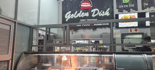 Golden Dish takeaway counter with illuminated food display and storefront sign
