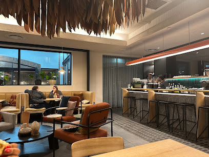 Woolworths Café Waterstone interior with bar, booths and diners