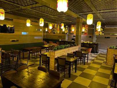 Taishan Restaurant Fairview Centre dining room with wooden tables and hanging lanterns
