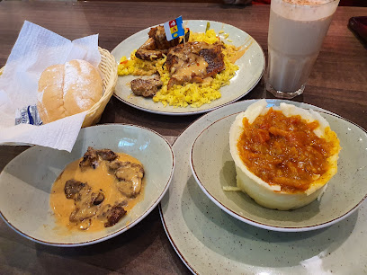 Pedro's Zevenwacht flame-grilled chicken with yellow rice and sides