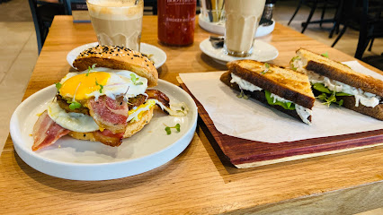 Bootlegger Gardens breakfast: bacon-and-egg bagel, toasted sandwich and lattes