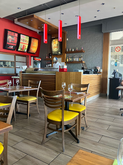 Simply Asia Horizon Bay dining area with wooden tables, yellow chairs and service counter