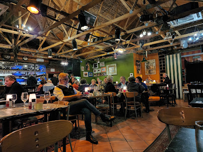 Die Boer Restaurant Durbanville interior with diners at wooden tables