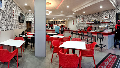 Andiccio24 Green Point interior with red seating, service counter and staff
