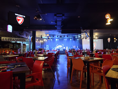 HEROES Live Restaurant Brackenfell interior with stage and dining tables