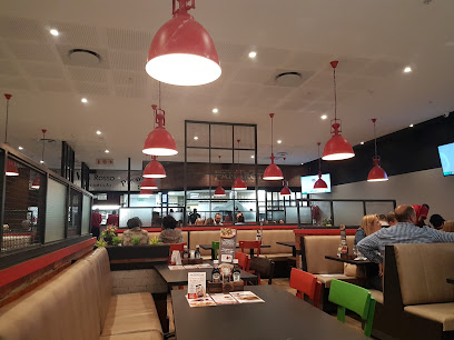 Panarottis Table Bay Mall dining area with booths and red pendant lights