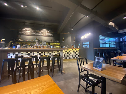 Bootlegger XS Salt River Halaal café interior with service counter, menu boards and seating