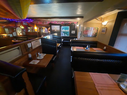 Silver Spoon Indian restaurant interior with cozy booths and table settings