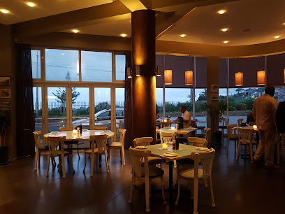 Barracudas Restaurant dining area with candlelit tables and ocean view