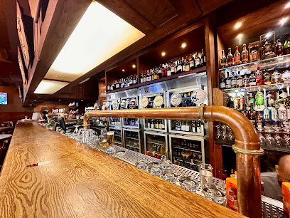 Foresters Arms wooden bar with brass beer taps and stocked liquor shelves