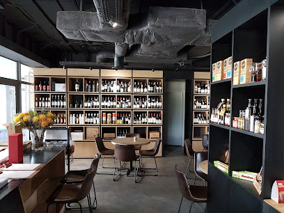 Urban Wines Durbanville interior with wine shelves, tasting tables, and gift displays