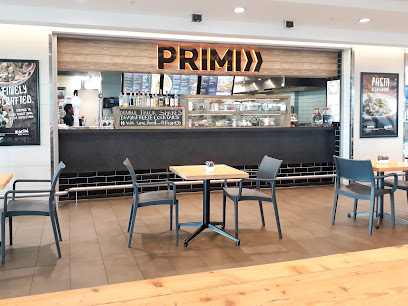 PRIMI Cape Town Airport cafe counter with seating and menu boards
