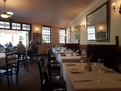 Chardonnay Deli Constantia dining room with set tables and natural light