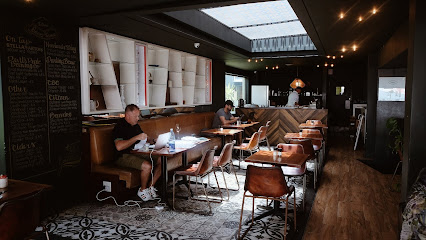 Sotano dining room with patrons using laptops at tables