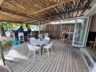 Covered wooden deck seating at The Pelican cafe in Hout Bay