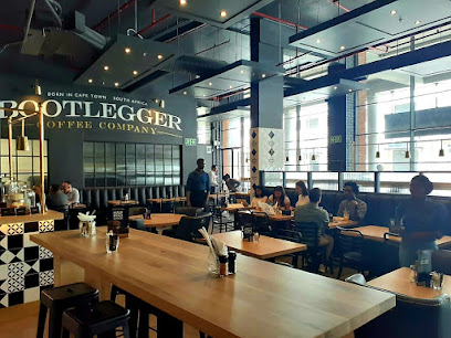 Bootlegger Woodstock Quarter Halaal cafe interior with communal tables and customers