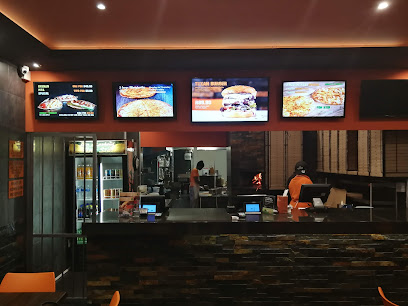 Bin Rashied Diep River counter with illuminated menu screens and staff