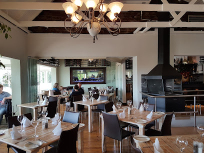Codfather Seafood & Sushi dining room with set tables and seated guests