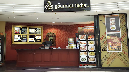 Gourmet India Cavendish Square counter in mall with menu boards